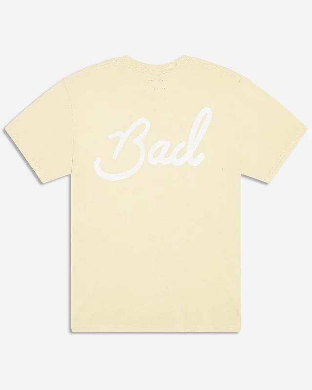 Men's button - front t - shirts with a unique artistic printPastel Yellow Bad Tee